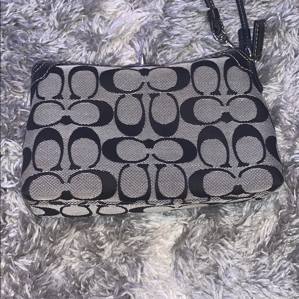 Another listing of the coach wristlet!